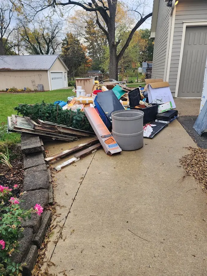 Dumpster being loaded with debris for Commercial Dumpster Rental in Alvarado